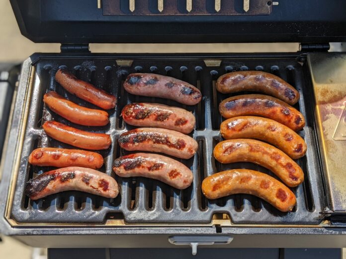 Masterbuilt Portable Charcoal Grill with Brats and Hot Dogs