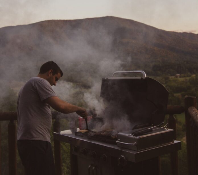 Guy Grilling in the Mountains