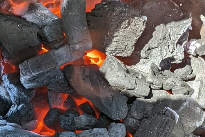 Lump Charcoal Lit in a Chimney