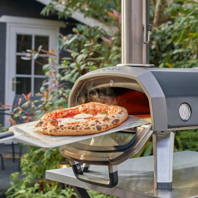 Loading Pizza in an Ooni Karu 12G Pizza Oven