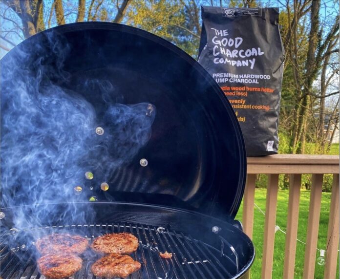 The Good Charcoal Bag Next to a Kettle Grill